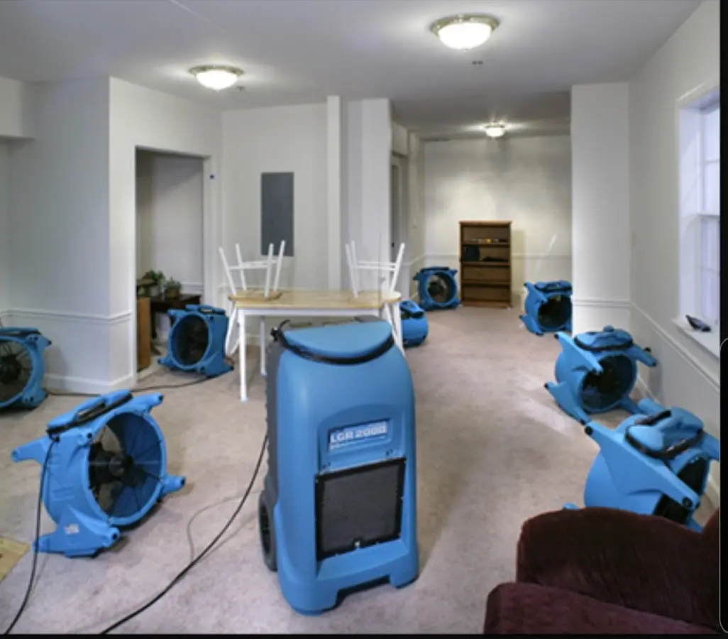 Air movers and dehumidifier setup for Water Damage Restoration in Malone